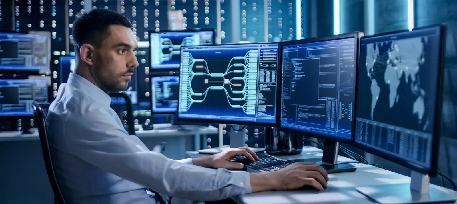 An engineer watching a managed estate from an operations desk